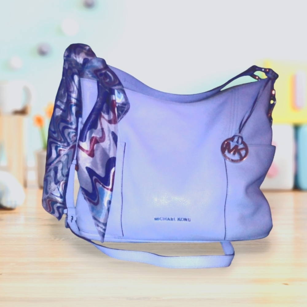 Authentic Michael kors light blue pebbled leather purse with crossbody strap.